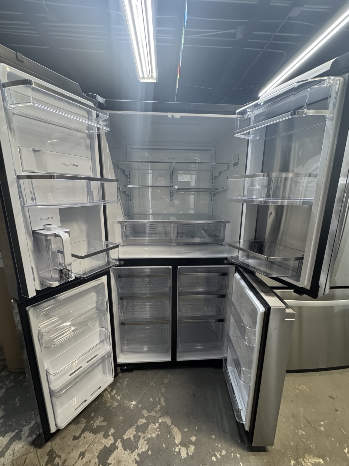 Interior of GE Profile PAD28BYTFS refrigerator with all four doors open