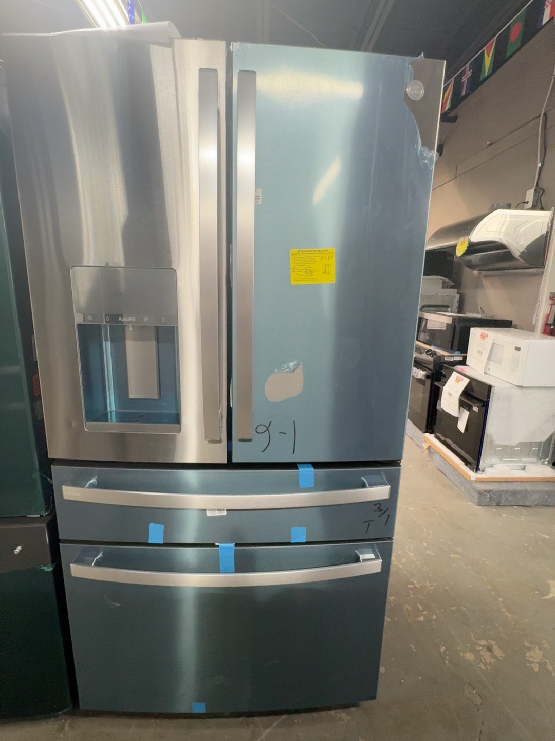 GE Profile PVD28BYNFS four-door refrigerator with external water and ice dispenser